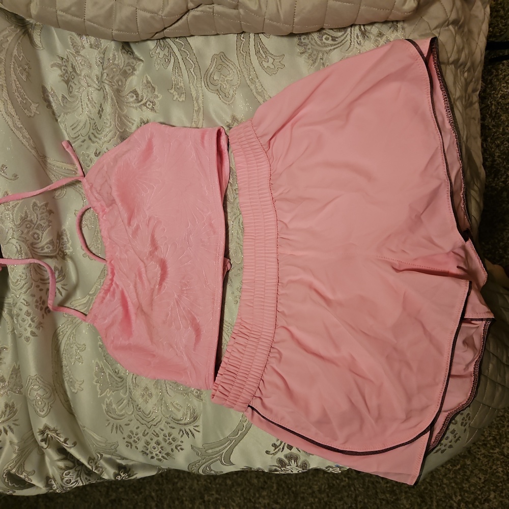 Pink, top and shorts for swimming.